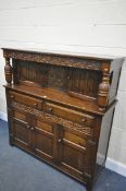 AN OAK LINENFOLD COURT CUPBOARD, with two drawers, width 141cm x depth 49cm x height 144cm (