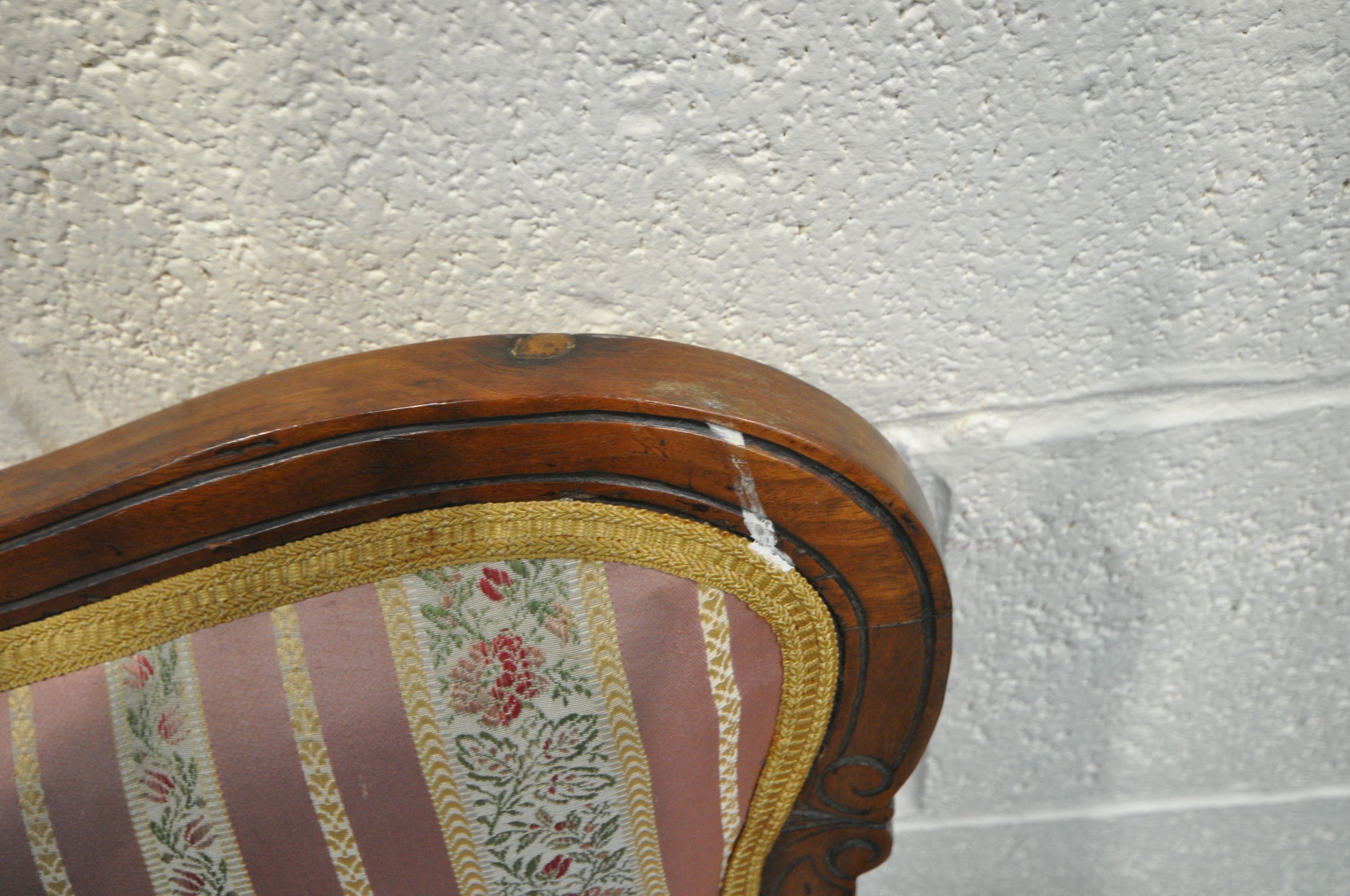 A 19TH CENTURY MAHOGANY SOFA, with carved open fretwork back, on stripped and floral upholstery, - Image 5 of 5