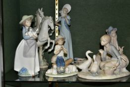 A GROUP OF LLADRO, NAO AND SIMILAR FIGURES, comprising a Lladro 'Food For Ducks' figure no 4849,