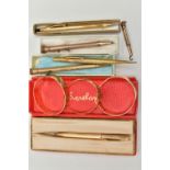 THREE BANGLES AND SIX PROPELLING PENCILS, two rolled gold, floral hinged bangles, each stamped 9ct