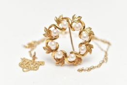 A 9CT GOLD CULTURED PEARL WREATH BROOCH AND A PENDANT NECKLACE, the openwork foliate wreath brooch