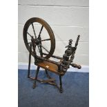 A STAINED BEECH SPINNING WHEEL