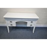 A WHITE FINISH DRESSING TABLE, with seven including three secret drawers, width 124cm x depth 51cm x