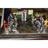AN EAGLEMOSS D.C. COMICS BATMAN CHESS SET AND BOARD, complete with 32 character pieces, appears in