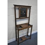 AN OAK HALL STAND, with a central mirror, width 83cm x depth 27cm x height 167cm (condition:-surface