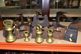 A GROUP OF WEIGHTS AND SHOE LASTS, comprising eight cast iron weights by Avery and others,