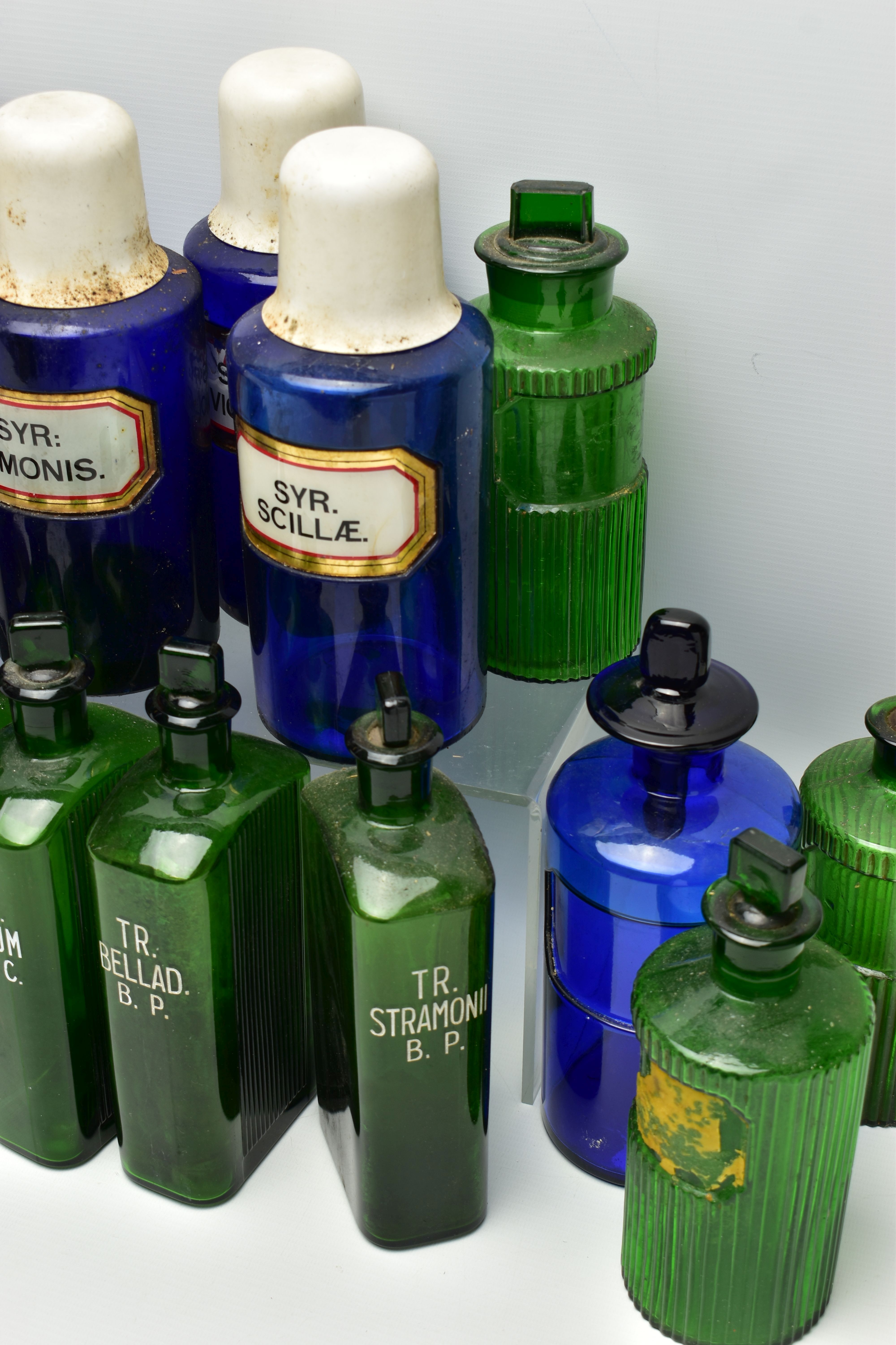 A COLLECTION OF TWENTY THREE COLOURED GLASS PHARMACY BOTTLES, comprising ten blue cylindrical - Image 5 of 5