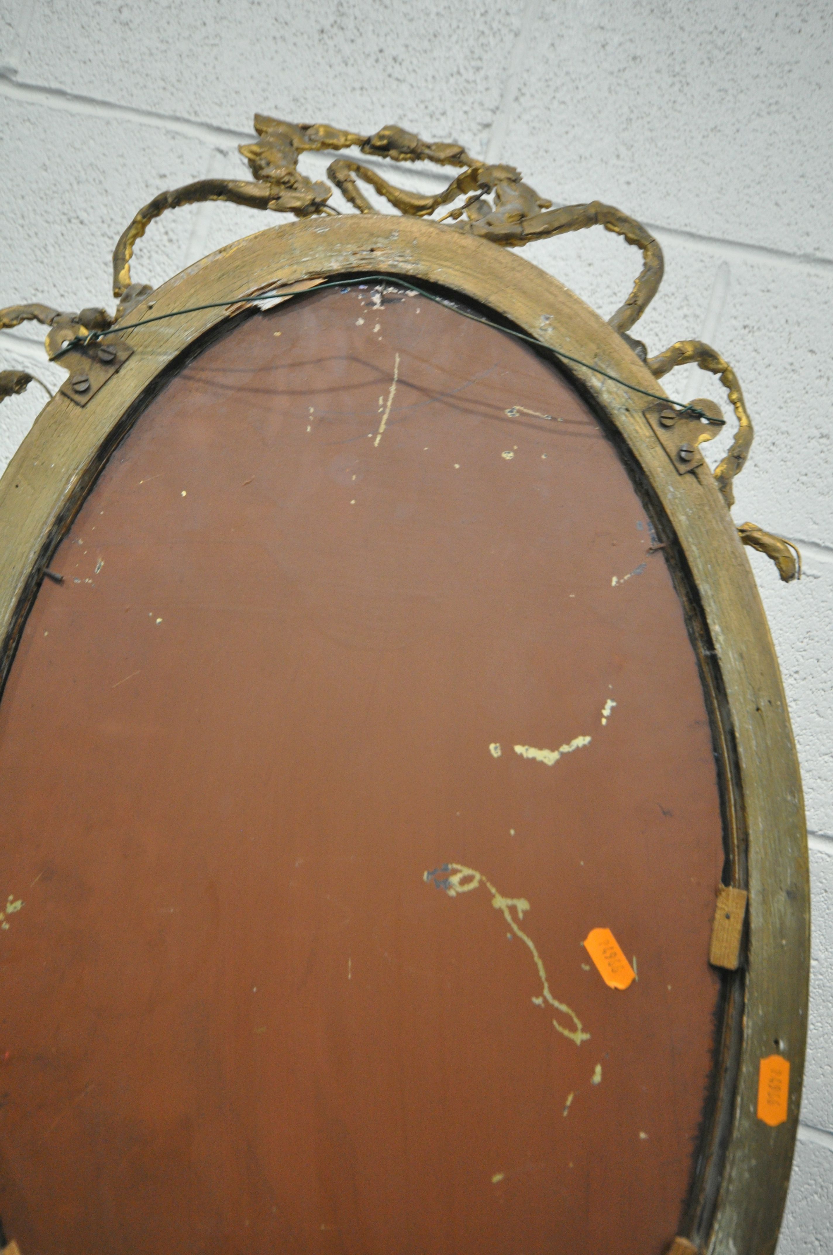 A NEOCLASSICAL GILTWOOD OVAL WALL MIRROR, 19th century, bevelled edge plate, with central surmount - Image 10 of 10