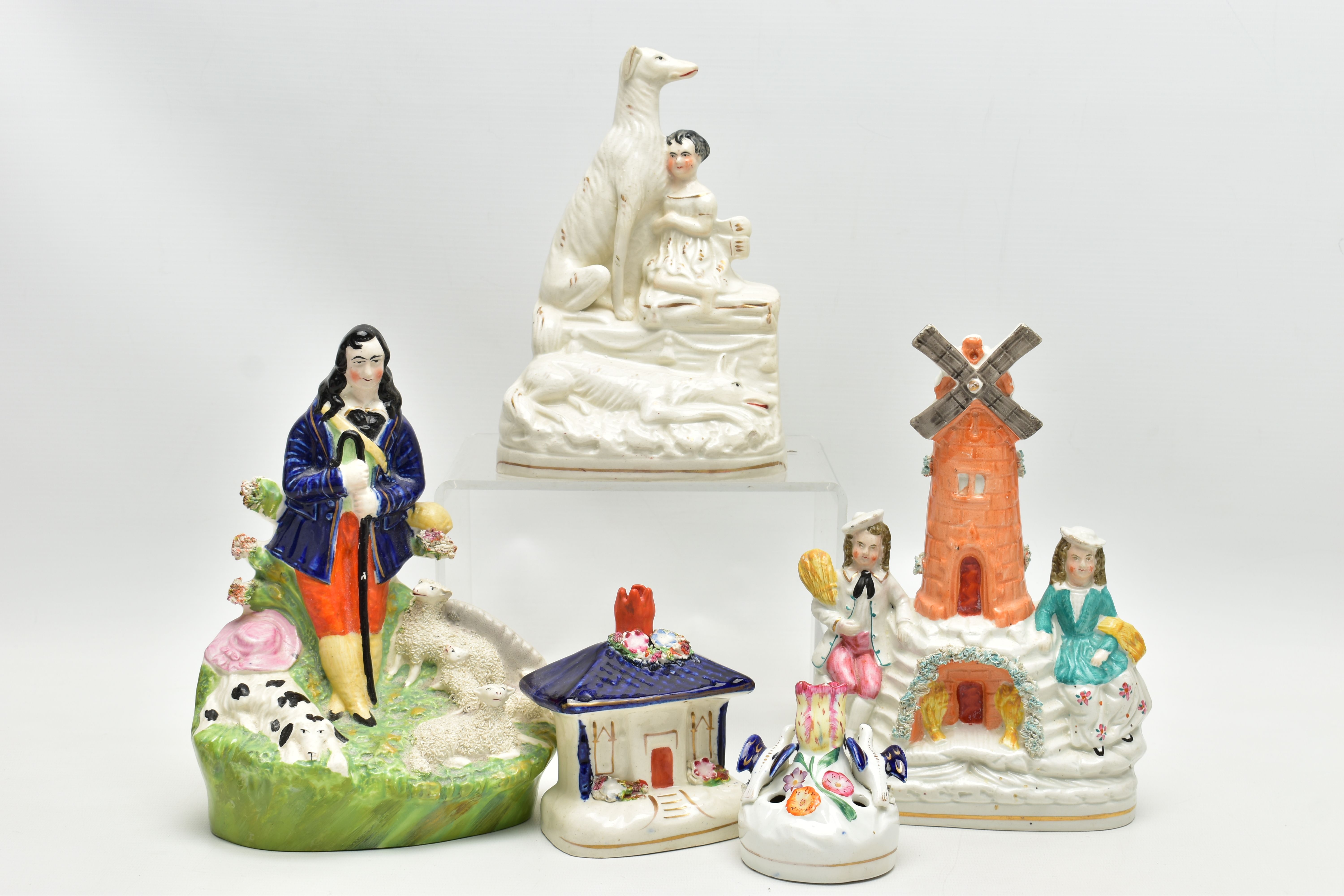 FIVE VICTORIAN STAFFORDSHIRE POTTERY FIGURES, ETC, comprising a windmill with boy and girl seated