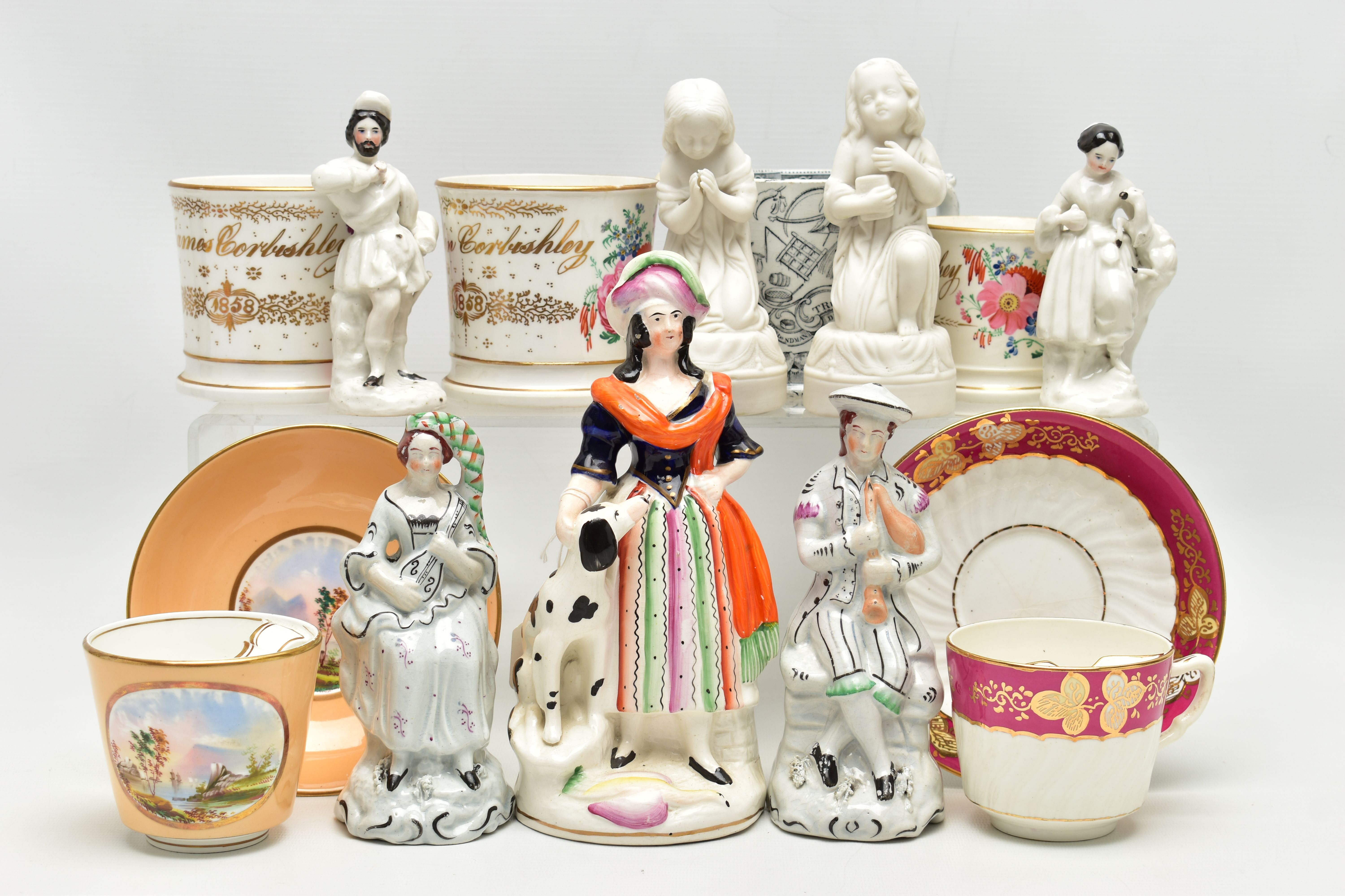 A GROUP OF 19TH AND EARLY 20TH CENTURY CERAMICS, comprising a family group of three hand painted