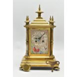 A LATE 19TH CENTURY FRENCH BRASS AND PORCELAIN PANEL CLOCK, the caddy pediment with five turned