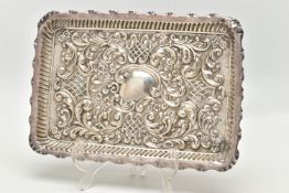 AN EDWARDIAN SILVER TRAY, rectangular form, scalloped edges, embossed with scrolling foliage and