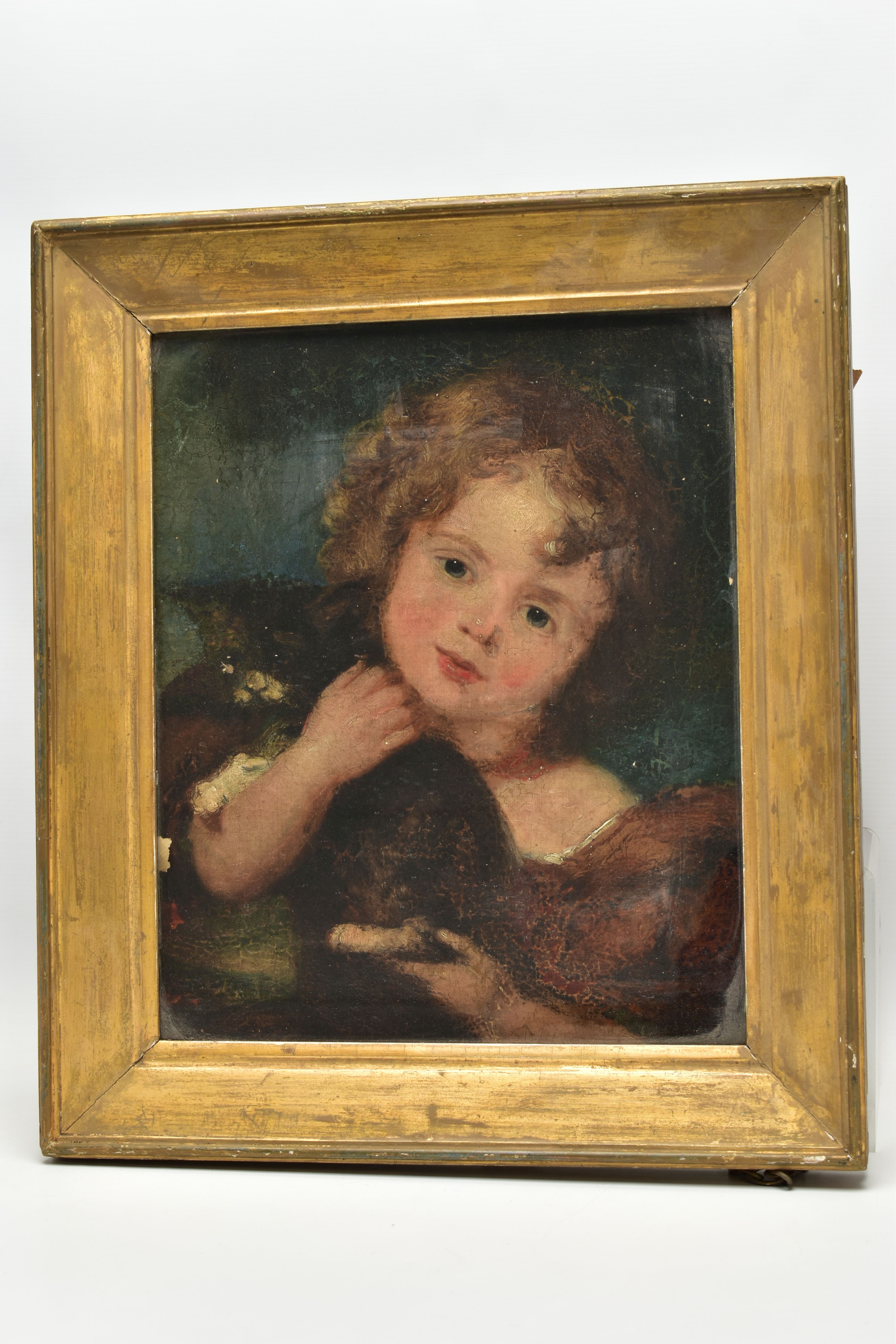 19TH CENTURY BRITISH SCHOOL, a head and shoulders portrait of a child holding a black and white cat,