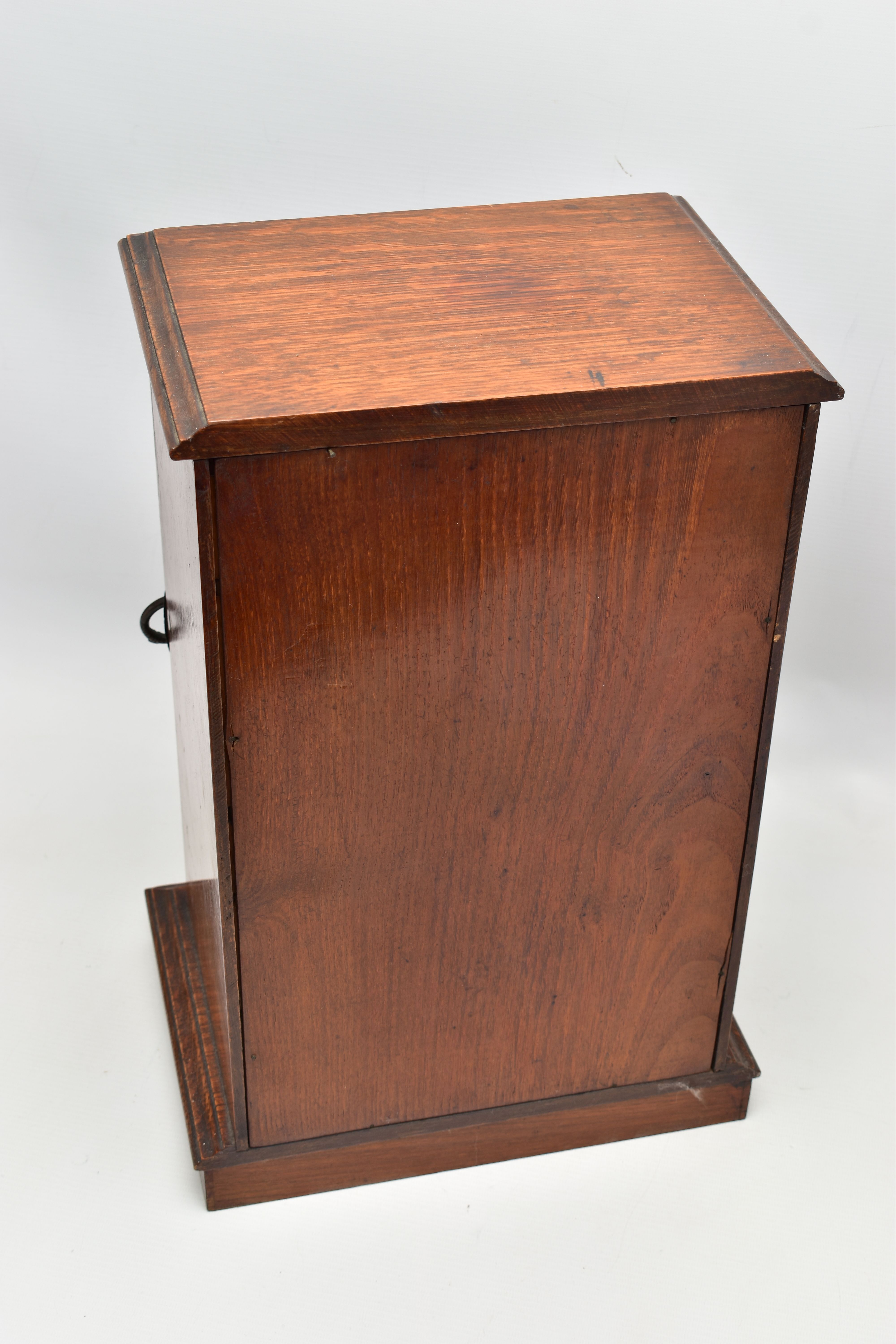 A LATE VICTORIAN OAK CASED SMOKERS CABINET, the bevel edged glazed door opening to reveal a pipe - Image 6 of 11