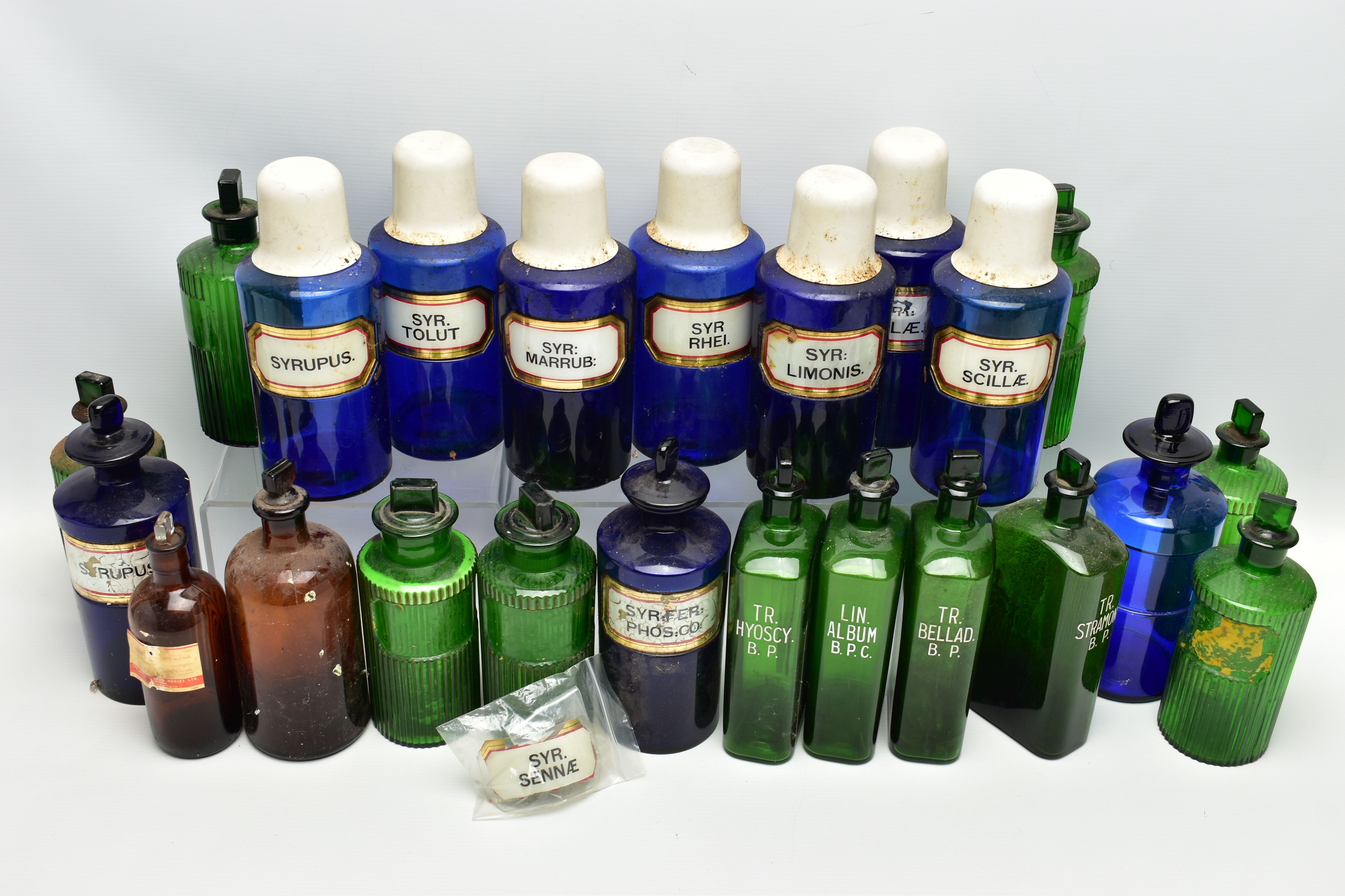 A COLLECTION OF TWENTY THREE COLOURED GLASS PHARMACY BOTTLES, comprising ten blue cylindrical - Image 2 of 5