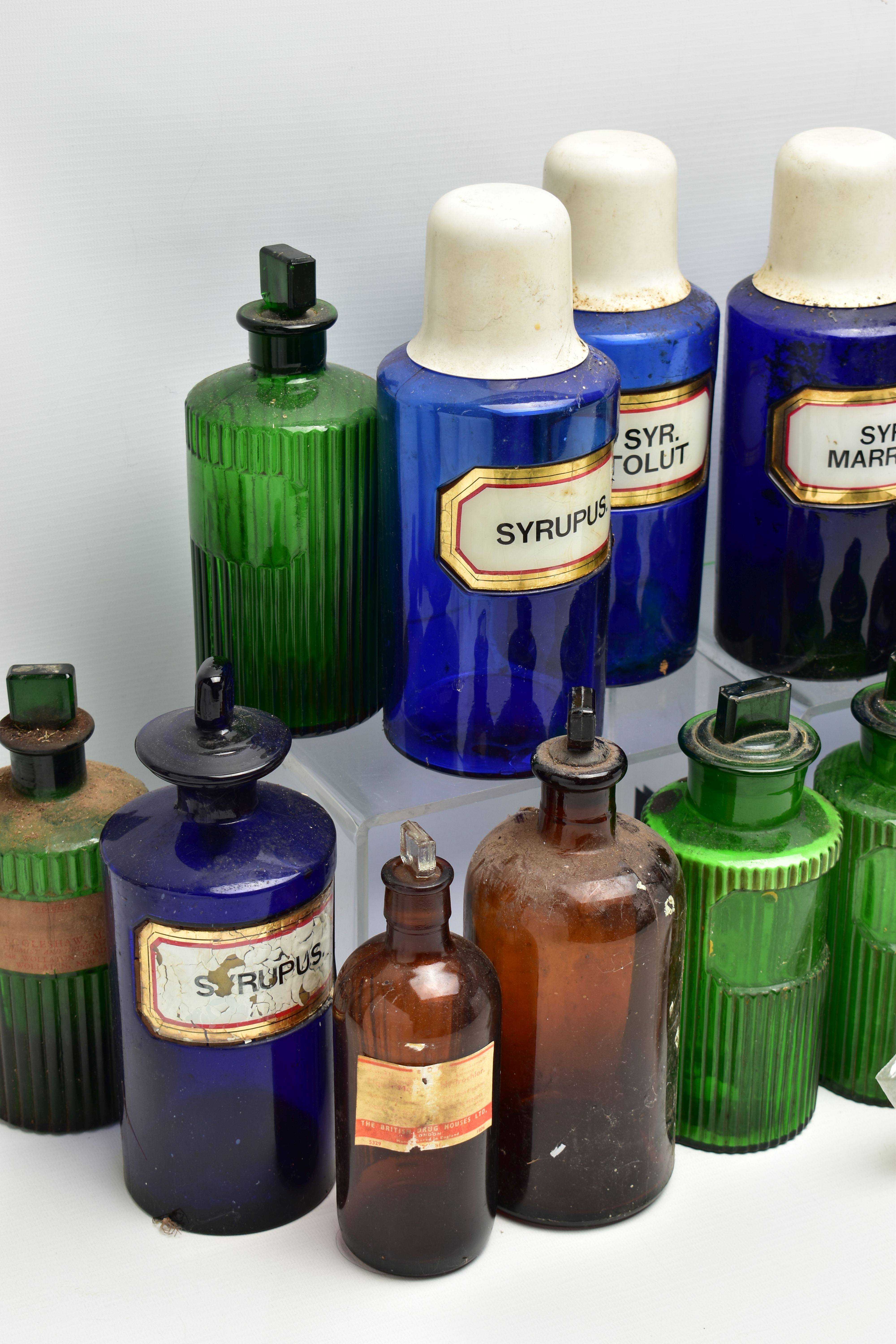 A COLLECTION OF TWENTY THREE COLOURED GLASS PHARMACY BOTTLES, comprising ten blue cylindrical - Image 3 of 5