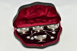 A CASED SET OF FOUR VICTORIAN SILVER PEDESTAL SALTS WITH SPOONS, the salts of oval form with stop