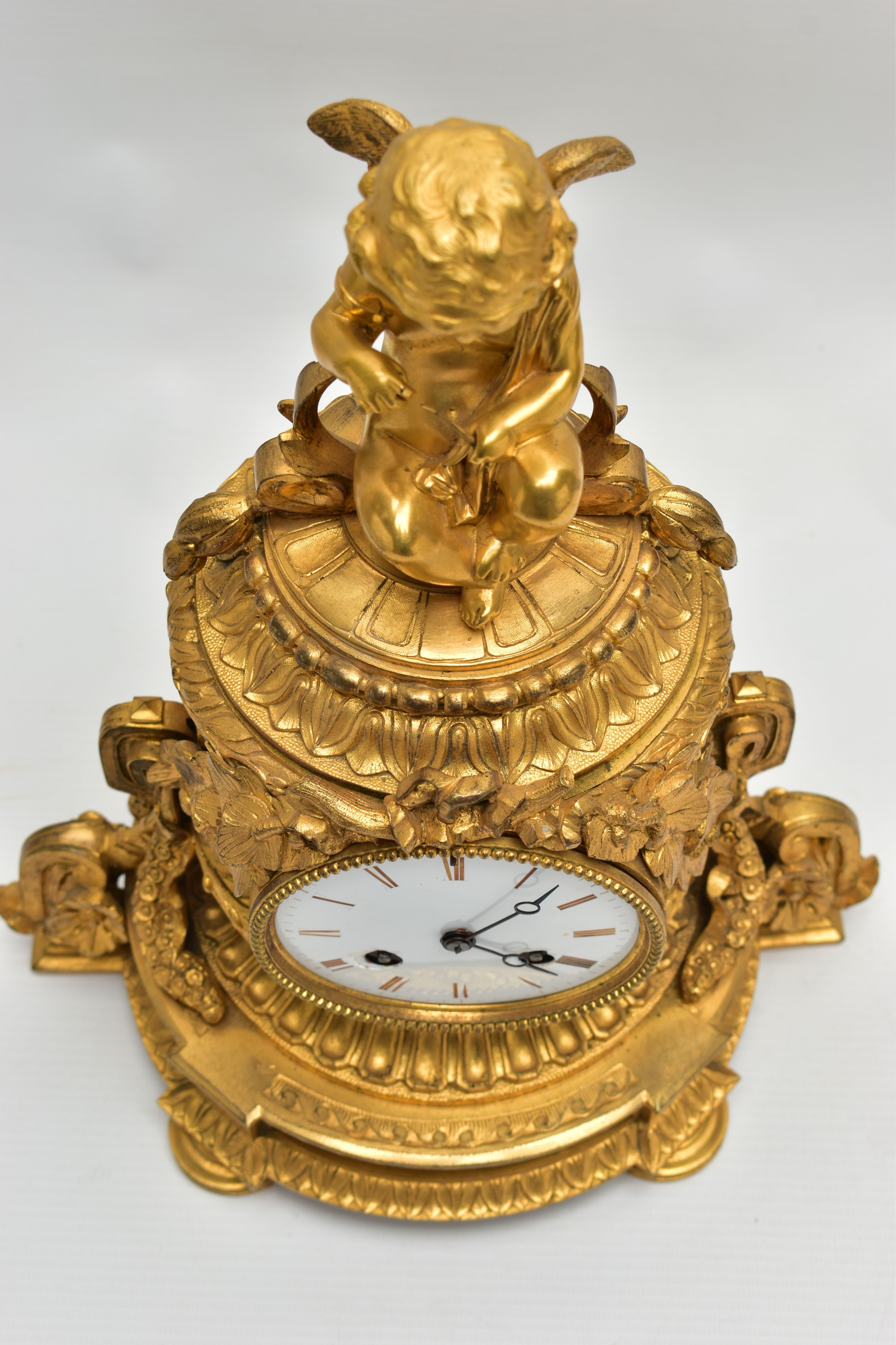 A LATE 19TH CENTURY FRENCH ORMOLU MANTEL CLOCK OF SHAPED CYLINDRICAL FORM, the circular top with - Image 13 of 16