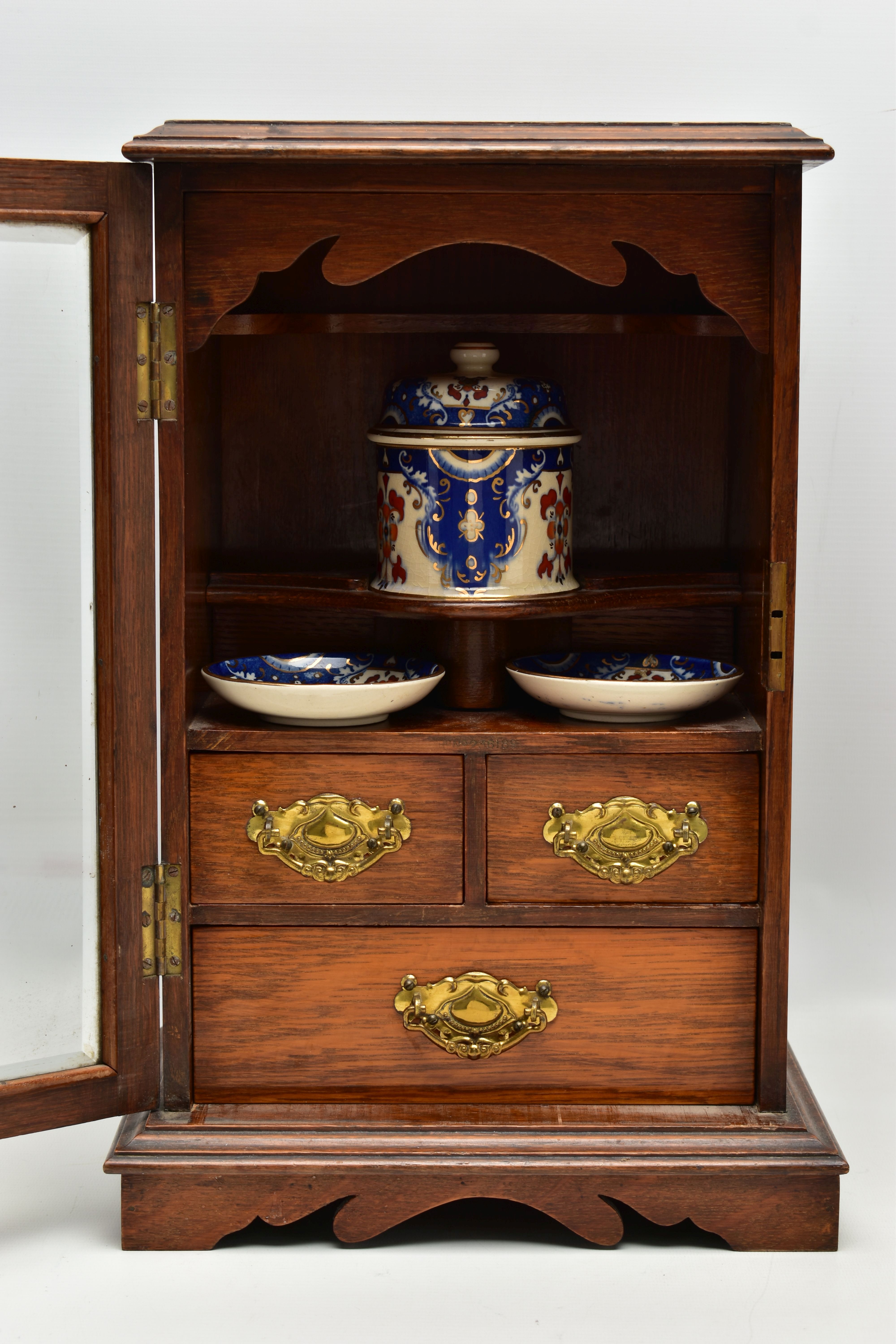 A LATE VICTORIAN OAK CASED SMOKERS CABINET, the bevel edged glazed door opening to reveal a pipe - Image 3 of 11