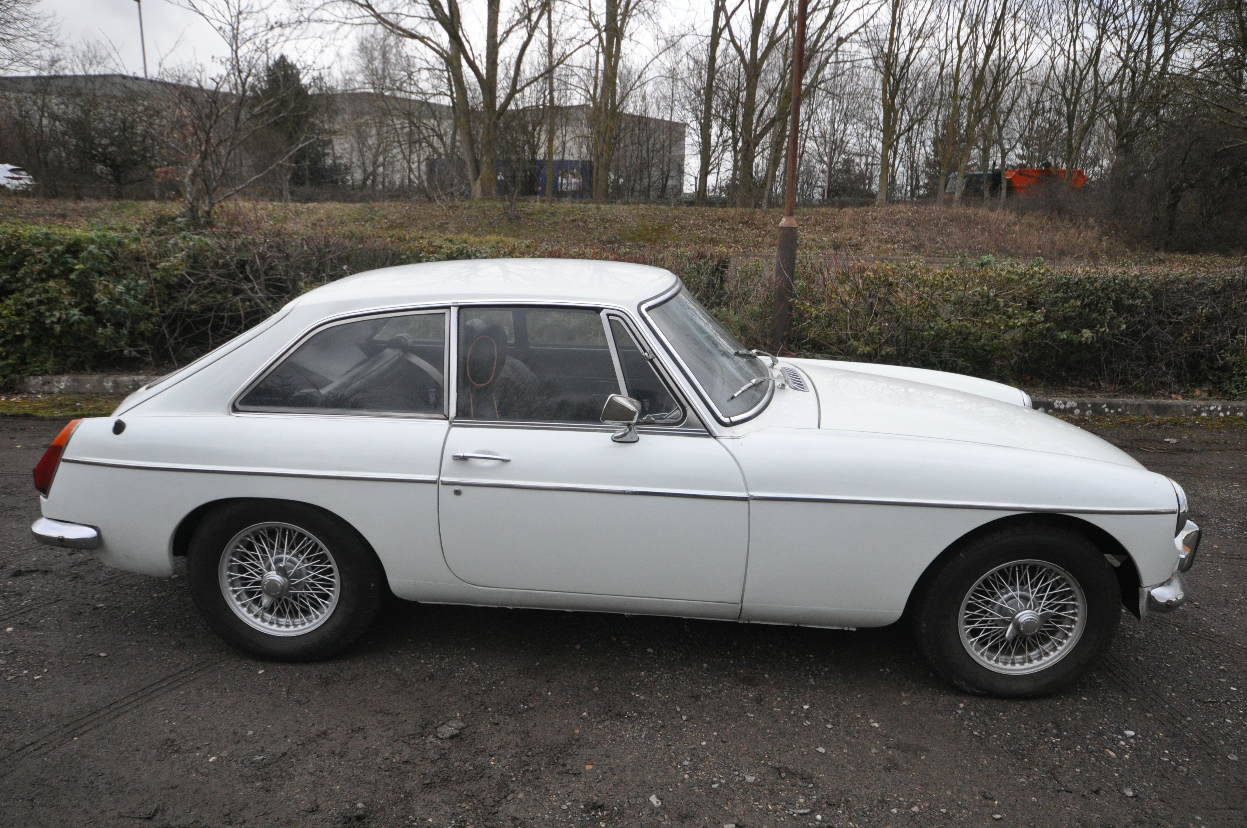 A BRITISH CLASSIC MGB GT SPORTS CAR, mark lll, in white and silvered trim, black leather and red - Image 3 of 24
