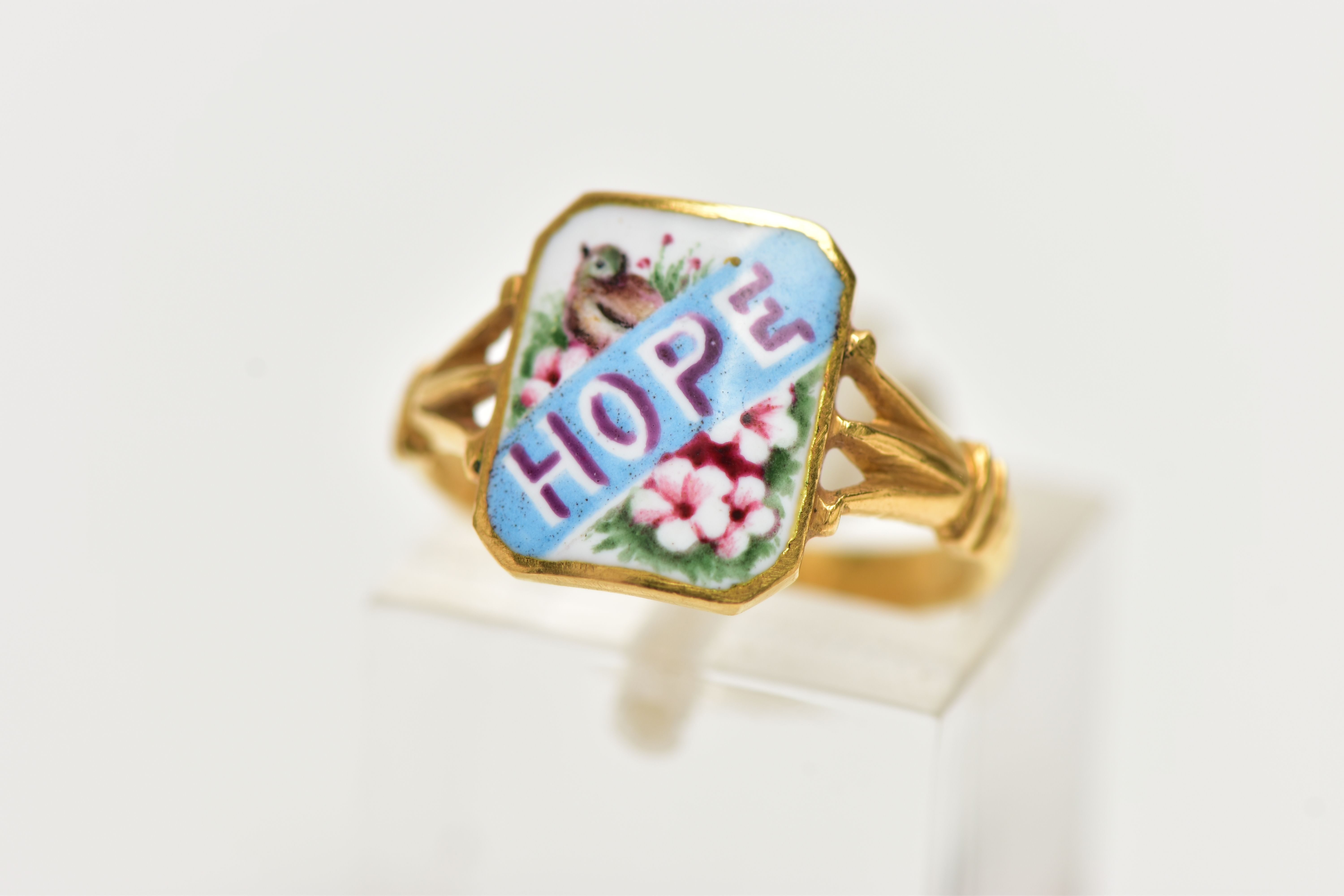 AN EARLY 20TH CENTURY YELLOW GOLD ENAMEL SWEETHEART RING, the rectangular-shape enamel panel reading