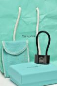 A CASED TIFFANY & CO. PADLOCK, the black titanium padlock, with black rubber loop, signed 'NY T& Co.