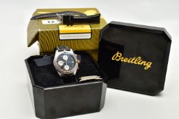 A BREITLING CHRONOMAT DATE WRISTWATCH, the black dial with subsidiary dials at six, nine and