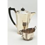 A GEORGE V SILVER HOT WATER JUG AND A LATE VICTORIAN TWIN HANDLED SUGAR BOWL, the hot water jug of