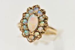 A 9CT GOLD OPAL CLUSTER RING, set with a principal marquise shape opal cabochon surrounded by