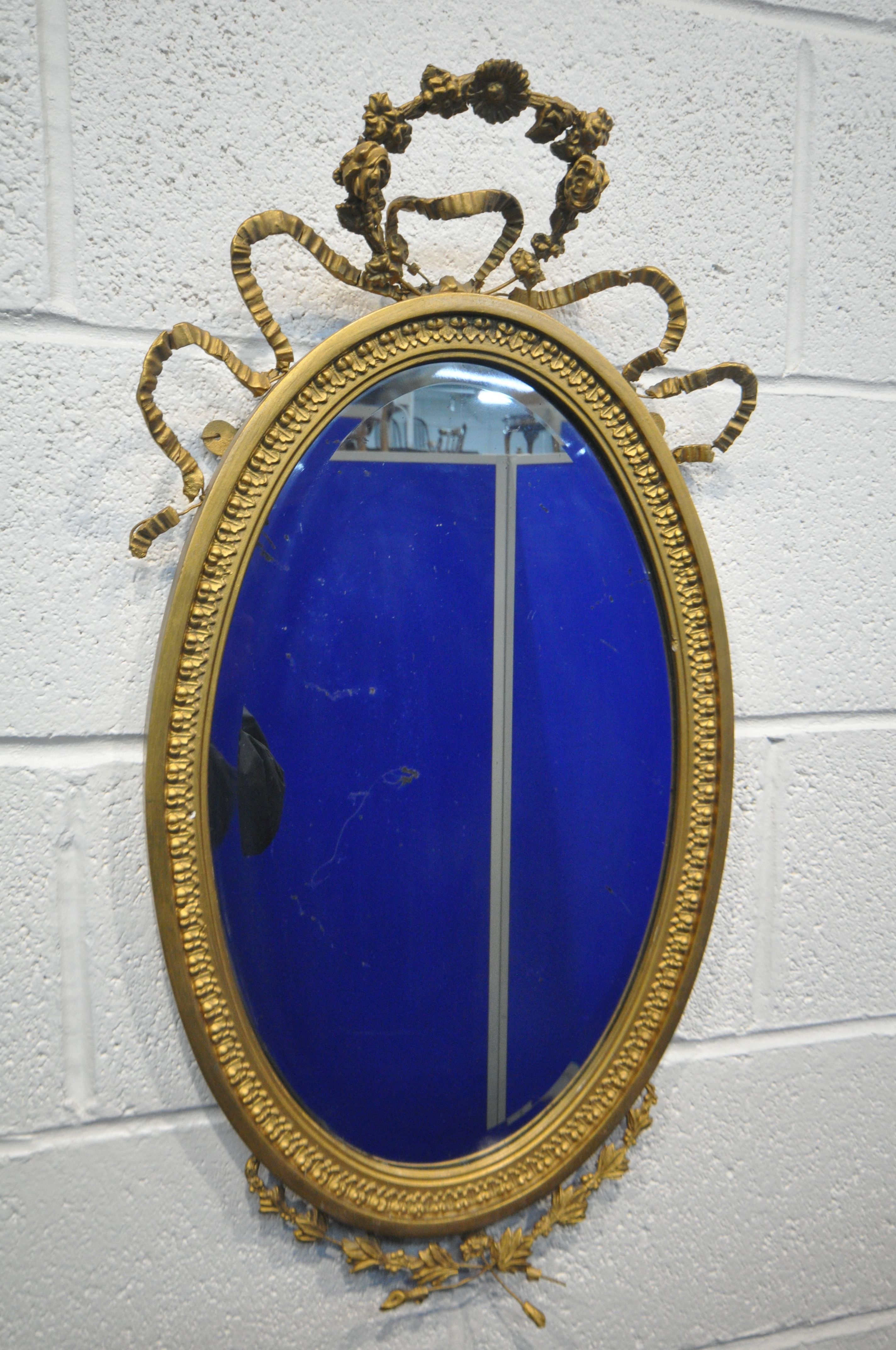 A NEOCLASSICAL GILTWOOD OVAL WALL MIRROR, 19th century, bevelled edge plate, with central surmount - Image 6 of 10