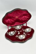 A CASED SET OF FOUR EDWARDIAN GOLDSMITHS & SILVERSMITHS CO LTD SILVER SALTS, of twin handled oval