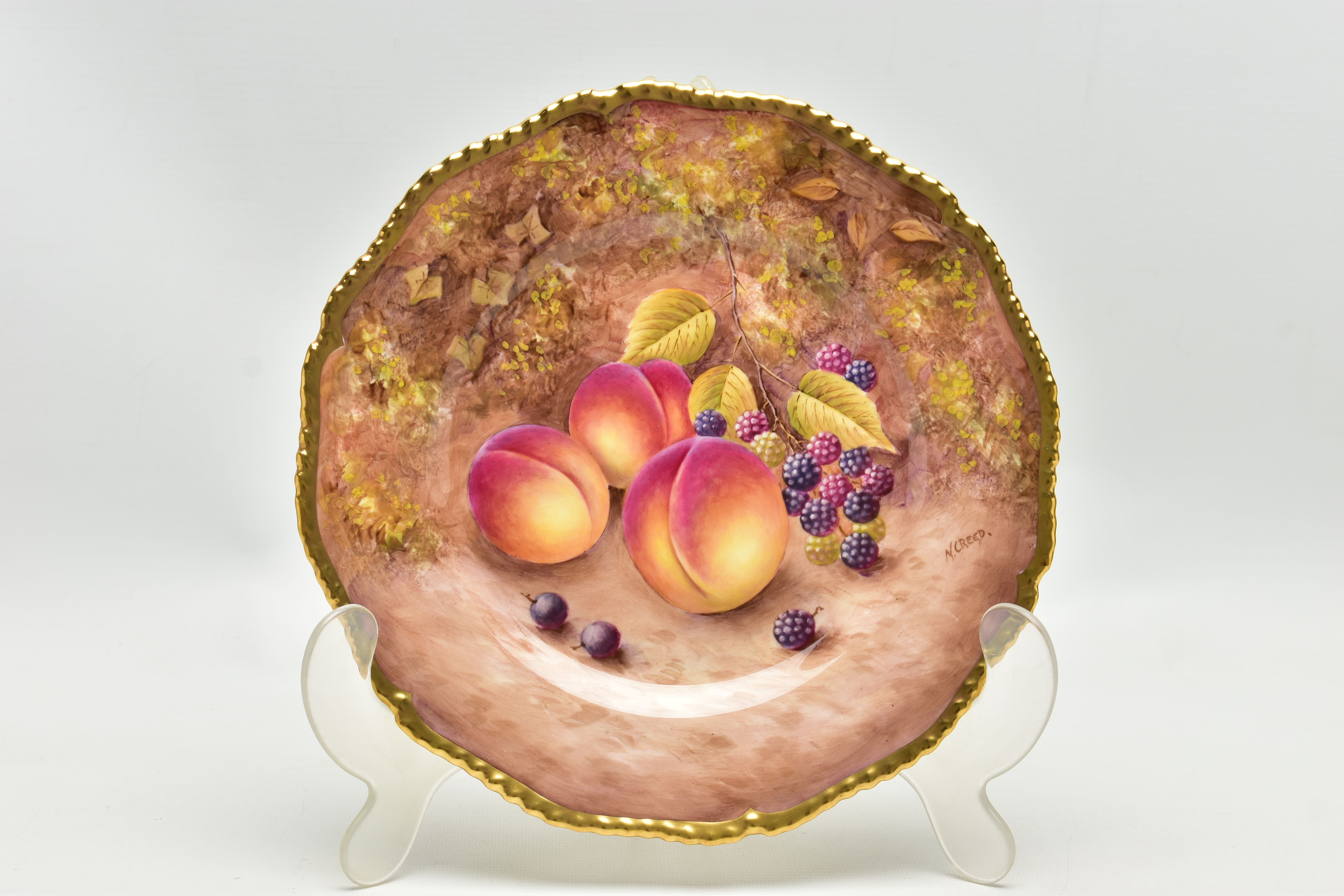 A ROYAL WORCESTER FRUIT STUDY PLATE OF SILVER SHAPE PAINTED BY N. CREED, hand painted with