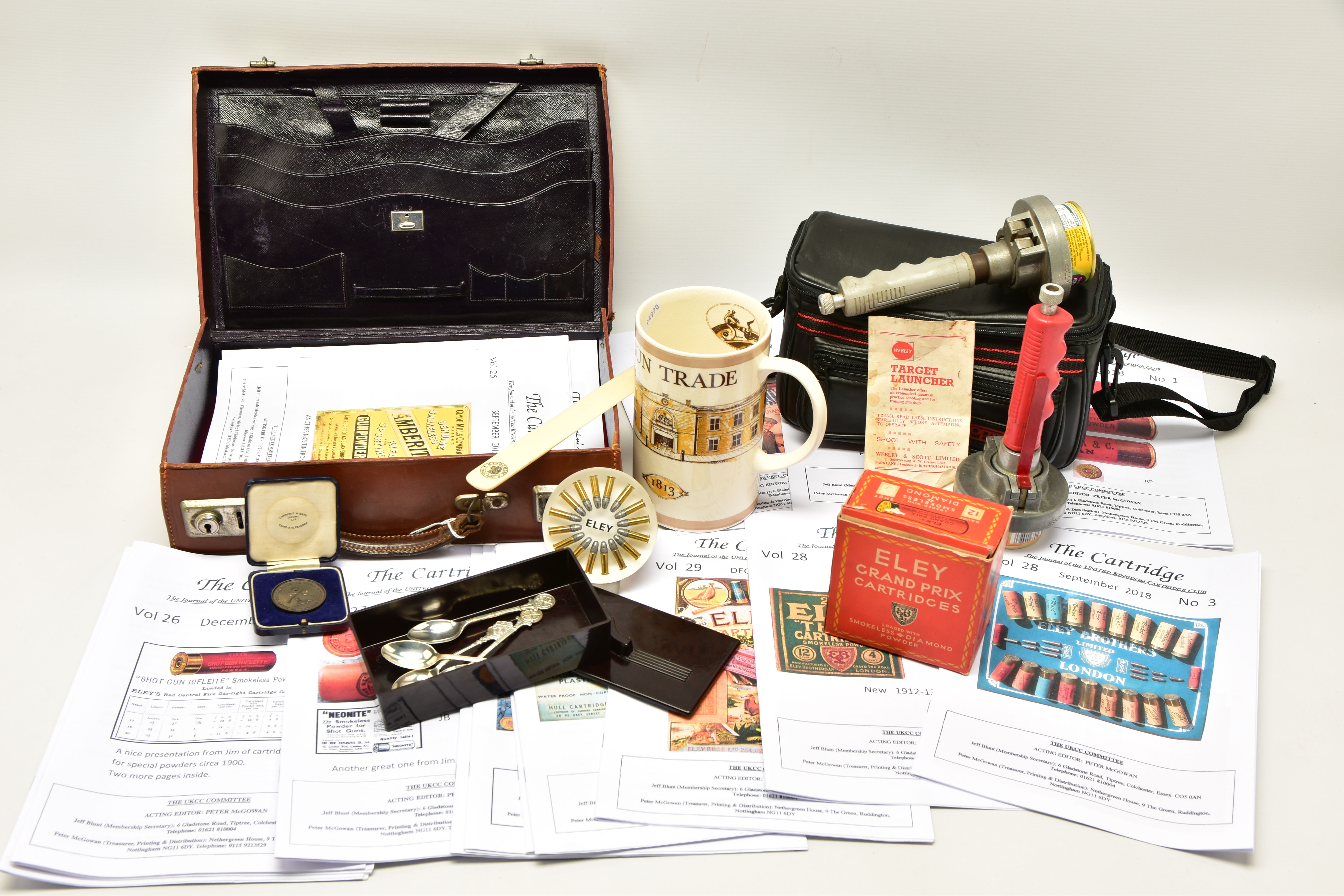 A BOX OF GUN / SHOOTING RELATED ITEMS, comprising a cased bonze Egypt Command Small Arms Meeting