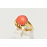 AN EDWARDIAN 18CT YELLOW GOLD CORAL RING, the coral cabochon measuring approximately 11.5mm diameter