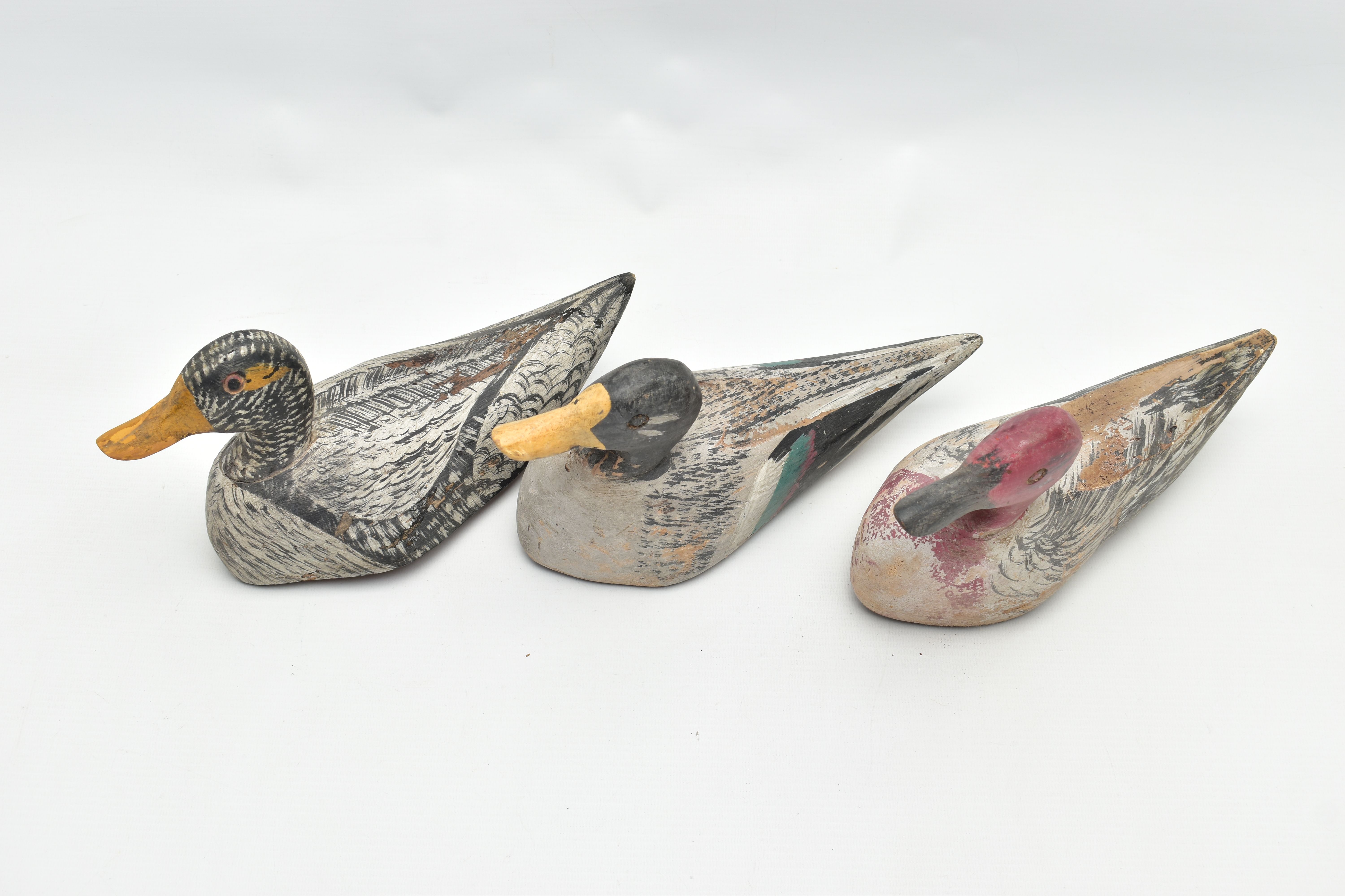 THREE CARVED WOODEN DECOY DUCKS WITH POLYCHROME PAINTED DECORATION, impressed circle eyes, - Image 2 of 8