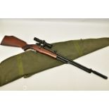 A .22 '' ROTARY MAGAZINE PUMP UP AIR RIFLE fitted with a beech stock, in working order and excellent