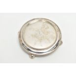 A GEORGE III CIRCULAR SILVER STAND, raised gadrooned rim with engraved crest to the centre, the