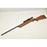 A .22'' B.S.A. MERCURY AIR RIFLE fitted with a Bisley scope, serial number ZB1112, its front and