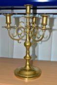 A BRASS FOUR FLAME CANDELABRUM, circular base, scroll effect branches, height 35cm (1) (Condition