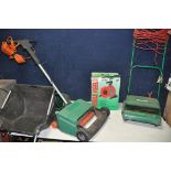 A QUALCAST CONCORDE LAWNMOWER with grass box along with Black and Decker GD200 scarifier and a 15m