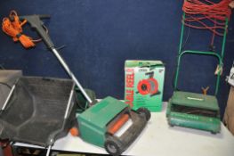 A QUALCAST CONCORDE LAWNMOWER with grass box along with Black and Decker GD200 scarifier and a 15m
