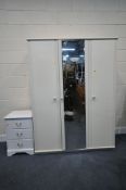 A WHITE TRIPLE DOOR WARDROBE, with a mirrored central door, width 133cm x depth 54cm x height 181cm,