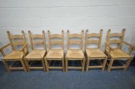 A SET OF SIX SOLID BEECH DINING CHAIRS, with drop in rush seats, including two carvers (