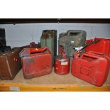 A COLLECTION OF PETROL CANS to include two 20litre cans, three 10litre cans, two 1 gallon petrol