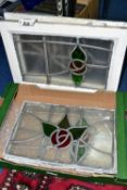 FIVE LEADED GLASS WINDOW PANES, two still in wooden frames, approximate sizes 44cm x 29cm, two of