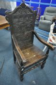 A CARVED OAK WAINSCOT CHAIR, with open armrests, width 61cm x depth 63cm x height 129cm