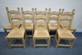 A SET OF EIGHT SOLID BEECH DINING CHAIRS, with drop in rush seats (condition:-general wear)
