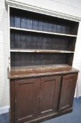 A 19TH CENTURY PAINTED PINE BOOKCASE, the open shelving top, above a base with triple panelled