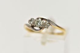 A YELLOW METAL THREE STONE DIAMOND RING, designed with a central claw set, round brilliant cut