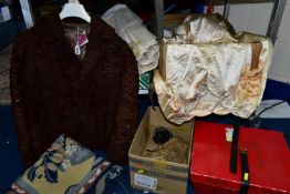 A GROUP OF TEXTILES, to include a heavily stained satin wedding dress in original delivery box,